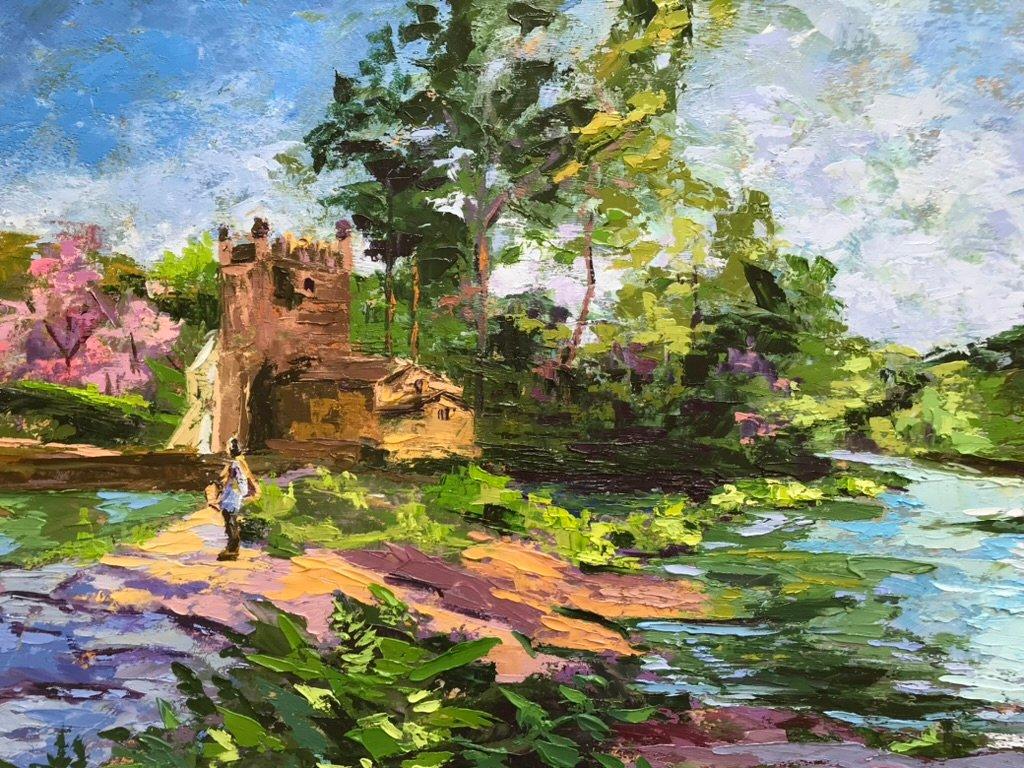 Escena de un hombre que esta observando el transcurrir de un río, junto a un molino.