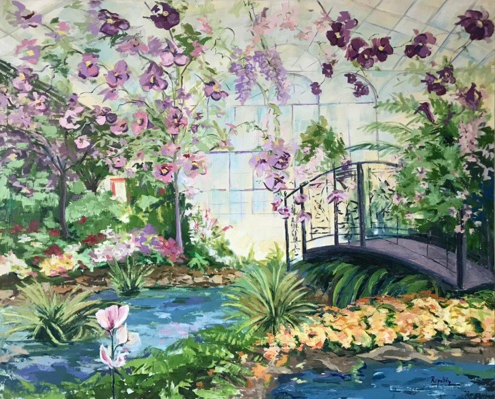 Invernadero con un estanque y un puente que lo cruza. Al fondo misterios puerta azul.